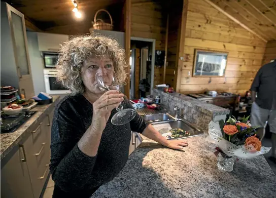  ?? PHOTO: GEORGE HEARD/STUFF ?? Jan Burney, from Brooklands, drinks a glass of water that the council has now put chlorine in.