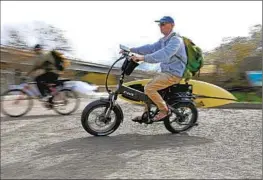  ?? Gary Coronado Los Angeles Times ?? A MAN RIDES an electric bicycle on the San Onofre State Beach Trail south of San Clemente, which last year banned electric bikes from its coastal boardwalk.