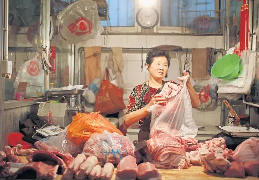  ?? EPA ?? Pfote, Ohren, Rüssel, Schwarten – das Schwein hat hundert Teile, und in China kommt fast alles in den Kochtopf.