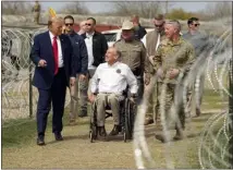  ?? ERIC GAY — THE ASSOCIATED PRESS ?? Republican presidenti­al candidate former President Donald Trump talks with Gov. Greg Abbott during a visit to the U.s.-mexico border Thursday in Eagle Pass, Texas.
