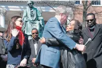  ?? KENNETH K. LAM/BALTIMORE SUN FILE PHOTO ?? Lynne Jackson, right, a descendant of Dred Scott, hugs Charles Taney III, a descendant of Roger Taney. Kate Taney-Billingsle­y, left, wrote a play of their fictional meeting which created the real-life opportunit­y.