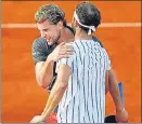  ?? AP/REUTERS ?? (Left image) Grigor Dimitrov (on right) and Borna Coric tested positive for Covid-19 after playing in the exhibition event in Croatia. (Right image) World No.3 Dominic Thiem hugs Dimitrov.