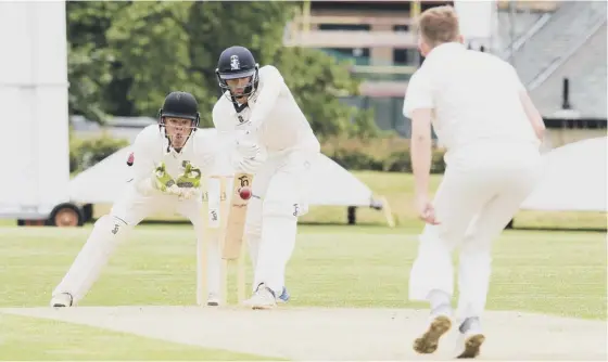  ??  ?? 2 Heriot’s batsman Hayes van Der Berg defends a delivery from Stewart’s Melville’s Callum Steel during the match between the two Edinburgh rivals at Inverleith on Saturday.