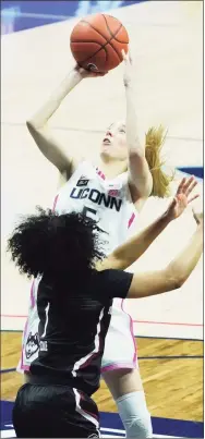  ?? David Butler II / USA Today ?? UConn’s Paige Bueckers (5) shoots against South Carolina guard Zia Cooke in overtime.