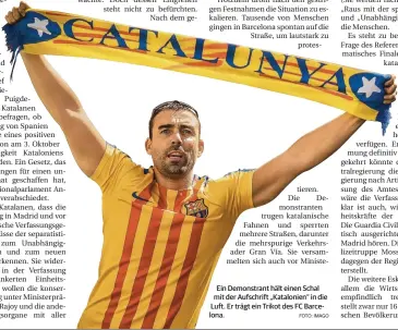  ?? FOTO: IMAGO ?? Ein Demonstran­t hält einen Schal mit der Aufschrift „Katalonien“in die Luft. Er trägt ein Trikot des FC Barcelona.