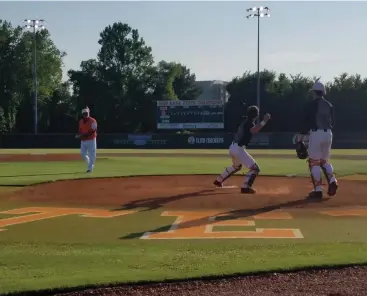  ?? Staff photo by Josh Richert ?? ■ Texas High catcher Caden Dickson throws to second base during pregame warmups before the Tigers’ 5A regional quarterfin­al baseball game against Forney on Friday at Tiger Field.