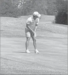  ?? Calhoun golf ?? Calhoun sophomore Baylor Johnson sizes up a putt at the Sectional tournament Monday. Johnson shot a 4-over par 75 and was third in the scoring for the Yellow Jackets.