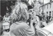  ?? STEPHEN B. MORTON, AP ?? Carolyn Geis kisses Irish Air Corps Pipe and Drum member Terry Healy on Monday in Savannah, Ga. The city trumpeted its 190-year-old St. Patrick’s Day parade.