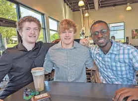  ?? CHARITA M. GOSHAY/THE CANTON REPOSITORY ?? Kolbe Hollcraft, left, 18, is the founding director of the United Haven Foundation, which is raising funds to assist orphans in Ghana. With him are co-vice presidents Andrew Dylewski, 19, and Jacob Darko, 26, a native of Accra, Ghana.