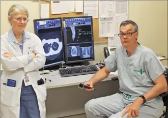  ?? Photo contribute­d ?? Kelowna Drs. Michael Humer and Barbara Campling are members of a thoracic oncology team that treats patients via video-conference appointmen­ts.