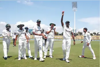  ?? AFP ?? Ebadot Hossain (second right) of Bangladesh celebrates his six wickets with teammates during the fifth day of the first Test against New Zealand at the Bay Oval in Mount Maunganui on Wednesday. —