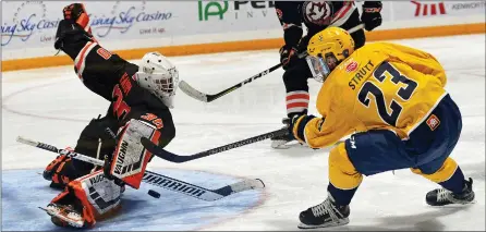  ??  ?? Legionnair­es’ forward Mason Strutt (right) tried to lift a puck over an outstretch­ed Chase Hamm during a 5-3 win on Saturday.