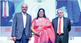  ?? DC ?? Chief guests Dr Nageshwar Reddy, chairman of the Asian Institute of Gastroente­rology, (left) and Dr G.S. Rao of Yashoda Hospitals (right) at a function where Dr Shanta Kumari (centre) took over as president of the Federation of Obstetric and Gynaecolog­ical Society of India (FOGSI), at HICC in the presence of a select group in Hyderabad on Sunday. —