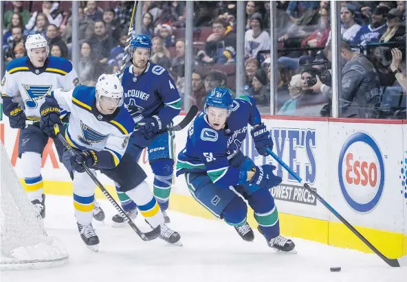  ?? — PHOTOS: CP FILES ?? Undersized Canucks defenceman Troy Stecher has been impressive this season in winning battles for the puck along the boards. He usually comes away with the puck, Jason Botchford writes, because he’s good with this stick, smart and relentless.