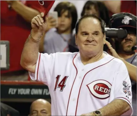  ?? AL BEHRMAN — THE ASSOCIATED PRESS ?? Pete Rose walks onto the field during ceremonies honoring the starting eight of the 1975-76 World Champion Reds in 2015. The Phillies scrapped plans to add Rose to their Wall of Fame.