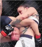  ?? AP FILE ?? Raquel Pennington, right, is shown during her fight against Miesha Tate in 2016. Pennington fights Holly Holm Saturday.