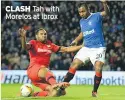  ??  ?? CLASH Tah with Morelos at Ibrox