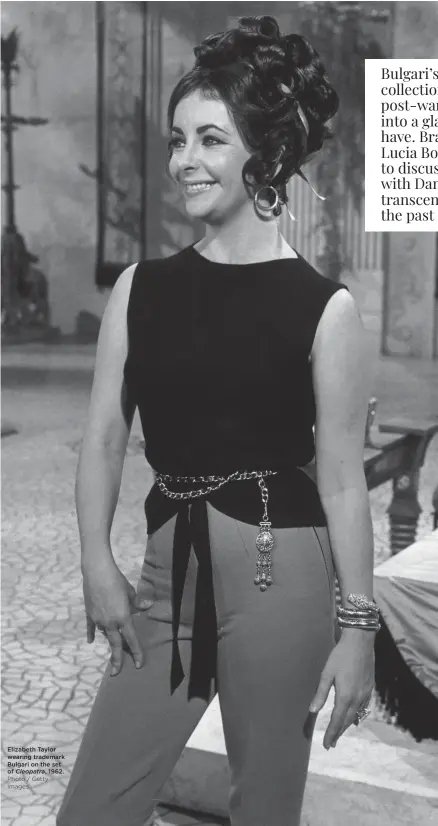  ?? Cleopatra, Photo / Getty Images ?? Elizabeth Taylor wearing trademark Bulgari on the set of 1962.