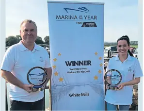  ?? PHOTO SUPPLIED ?? Operations manager Gary Butcher and marina administra­tor Kay Elderkin, with the 2020 and 2021 Inland Marina of the Year awards.