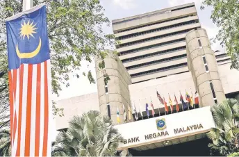  ?? — AFP photo ?? BNM emphasised that it is mandated to promote financial stability conducive to the sustainabl­e growth of the economy and that it would continue to promote financial stability even as the financial landscape continues to evolve.