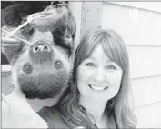  ??  ?? JENNY WALKER Selfie at Santa Ana Zoo with a two-toed sloth.