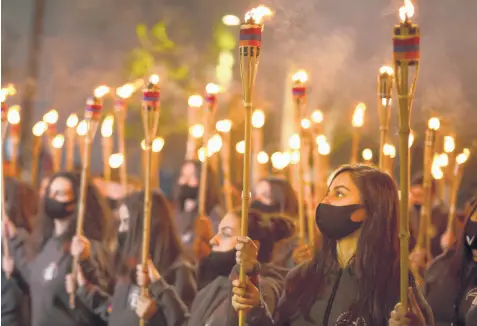  ?? GRIGOR YEPREMYAN/PAN PHOTO ?? People march Saturday to mark the 106th anniversar­y of the massacre of up to 1.5 million Armenians by Ottoman Turks in Yerevan, Armenia. Turkey castigated the White House for calling the killings a“genocide.”