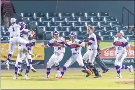  ?? PHOTO BY ROB WORMAN ?? McDonough’s baseball team celebrates after scoring the winning run in the bottom of the 13th inning of Tuesday night’s SMAC championsh­ip game at Regency Furniture Stadium in Waldorf. The Rams defeated Chopticon 5-4.