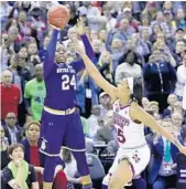  ?? RON SCHWANE/AP ?? Notre Dame’s Arike Ogunbowale puts up the winning shot over Mississipp­i State’s Victoria Vivians on Sunday. On Friday night, she hit a similar shot to knock off UConn.