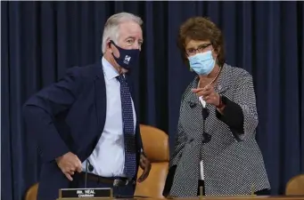  ?? AP file ?? BUILDING HIS PLAN: House Ways and Means Committee Chairman Richard Neal (DMass.), left, confers with Rep. Jackie Walorski (R-Ind.), as he presides over a markup hearing to craft the Democrats’ Build Back Better Act last month.