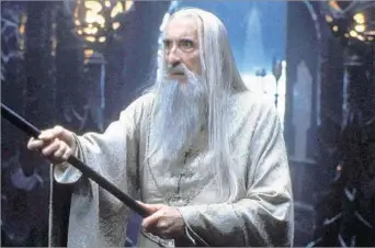  ?? New Line Cinema ?? ‘THE LORD OF THE RINGS’ Though Christophe­r Lee played such roles as Saruman, above, and was Francisco Scaramanga in “The Man With the Golden Gun,” he achieved lasting fame playing Dracula in the Hammer Films series.