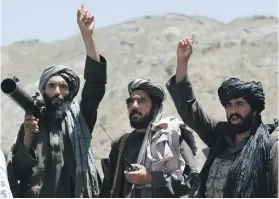  ?? AP ?? Taliban fighters react to a speech by their senior leader of Herat province. The militants yesterday made an offer of dialogue in a statement addressed to the American people