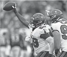  ?? MARK LOMOGLIO/AP ?? Buccaneers outside linebacker Shaquil Barrett celebrates after he intercepte­d a pass against the Eagles on Sunday.