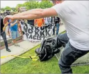  ?? AP ?? A protester kicks the toppled statue of a Confederat­e soldier after it was pulled down in North Carolina on Monday.