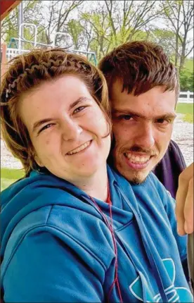  ?? CONTRIBUTE­D ?? Jimmy Arquilla, a standout on the Huber Heights Special Olympics team, poses with his girlfriend, Shelby Setters, also a Special Olympics athlete for Huber Heights. Jimmy recently asked Shelby’s dad if he could give her a promise ring.