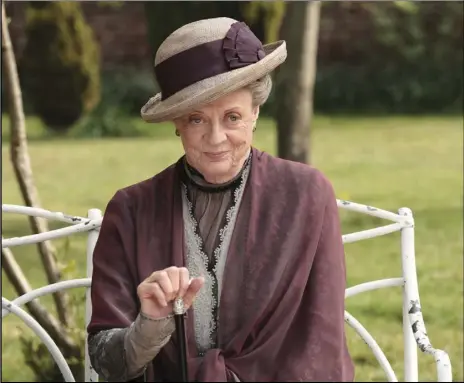  ?? AP PHOTO ?? This image released by PBS shows Maggie Smith as the Dowager Countess Grantham in a scene from the second season on “Downton Abbey.” As PBS’ “Masterpiec­e” marks its 50th anniversar­y Sunday.