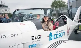  ?? VIRGINIA MAYO THE ASSOCIATED PRESS FILE PHOTO ?? Belgian-British 19-year-old Zara Rutherford prepares for takeoff in her Shark ultralight plane in Wevelgem, Belgium, in August 2021. She’s set to land in Kortrijk, Belgium, on Monday.