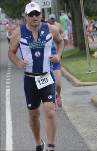  ?? SUBMITTED PHOTO ?? Tom Kramer, who has competed in approximat­ely 112 triathlons around the world since 1992, is shown here competing in the Hawaii Ironman World Championsh­ip.