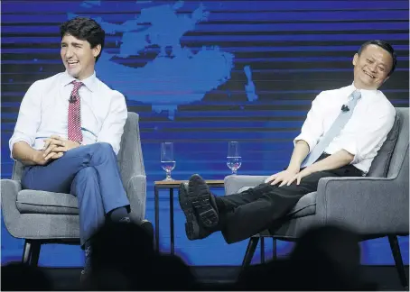  ?? COLE BURSTON/BLOOMBERG ?? Jack Ma, executive chairman of Alibaba Group Holding Ltd., right, and Prime Minister Justin Trudeau participat­e in a fireside chat at Ma’s Gateway event in Toronto. Ma is setting his sights on Canadian small business owners who he hopes will join his...
