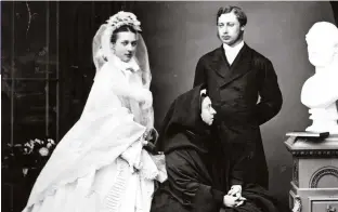  ??  ?? Prince Edward and his bride Princess Alexandra pose on their wedding day with Queen Victoria. The monarch had a deep dislike of her eldest son