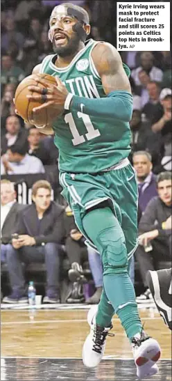  ?? AP ?? NFL STANDINGS Kyrie Irving wears mask to protect facial fracture and still scores 25 points as Celtics top Nets in Brooklyn.