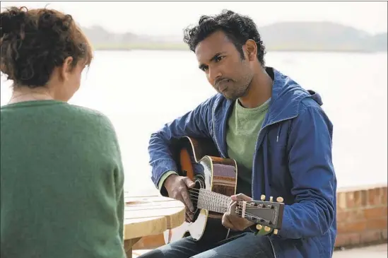  ?? Jonathan Prime Universal Pictures ?? LILY JAMES plays the manager of Himesh Patel’s struggling musician, who wrestles with the fact he’s the only person who can remember the Beatles in “Yesterday.”