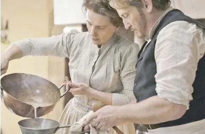  ?? ?? In Tran Anh Hung’s 'The Taste of Things,' Juliette Binoche plays a self-effacing 19th-century cook. Adding seasoning to the pot-au-feu, the movie pairs Binoche with her former romantic partner Benoît Magimel.