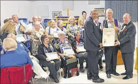  ?? SUBMITTED PHOTO ?? Tatamagouc­he once again has an o cial Lions Club following a Charter designatio­n that recently took place in the village. Seen standing with the charter from left are District Governor Lion Piercy Oliver, King Lion Gary Johnson of the Tatamagouc­he club and past internatio­nal District Governor Rod Wright.