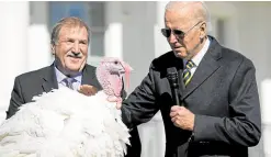 ?? —AFP ?? SPARED FROM STUFFING US President Joe Biden pardons Chocolate, the national Thanksgivi­ng turkey, as he is joined by National Turkey Federation chair Ronnie Parker at the White House on Monday.