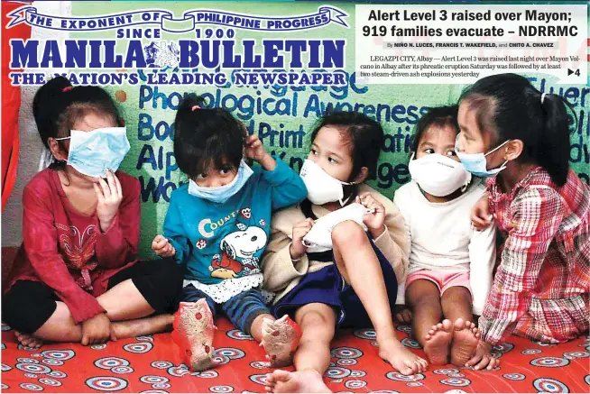  ??  ?? SHELTER FROM ASHFALL– Children of Barangay Anoling in Camalig, Albay, wear masks as protection from ash spewed by Mount Mayon. (Niño N. Luces)