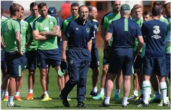  ??  ?? GROUP CHAT: Martin O’Neill walks away after addressing the Ireland squad this week