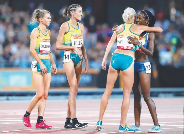  ?? Picture: GETTY IMAGES ?? Eloise Wellings, Madeline Hills and Celia Sullohern won the crowd’s appreciati­on when they made the effort to congratula­te last placegette­r Lineo Chaka of Lesotho after the 10,000m.