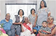  ?? SIBONELO NGCOBO
African News Agency (ANA) ?? DHANABAGIA­M ‘Dhanum’ Govender celebrates her 100th birthday with her brother Ganesh Nair, left, and daughters, from left, Devi Naidoo and Nero Govender and her daughter-in-law, Vijay Govender. Seated front is her daughter, Shireen Lutchman, with Govender’s great-grandson, Aiden Mahomed. |