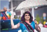  ?? MARLA BROSE/JOURNAL ?? Miss New Mexico Pride 2018 Felicia Roxx Starr Faraday waves to the crowds that lined Central Avenue during Saturday’s Pride Parade.