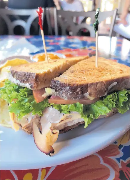  ?? JASON K. WATKINS/FOR THE JOURNAL ?? The turkey and Swiss sandwich is served on green chile bread at Golden Crown Panaderia. It’s served with tortilla chips and queso.